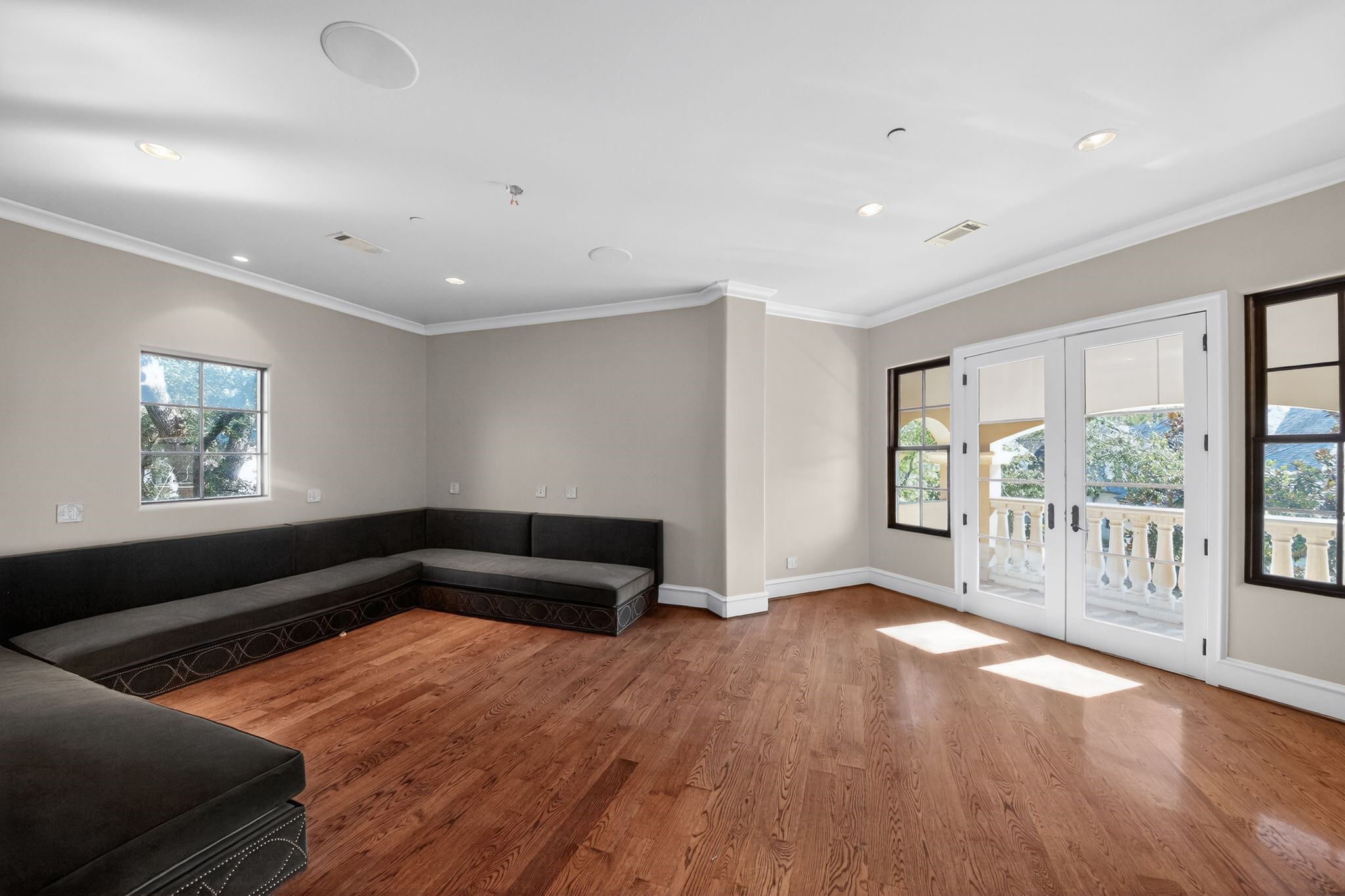 11117 Beinhorn Road Houston, TX 77024 - Photo 17 of 48 a living room with a couch and a large window