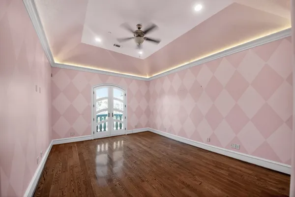 a bathroom with a granite countertop sink a toilet and a mirror