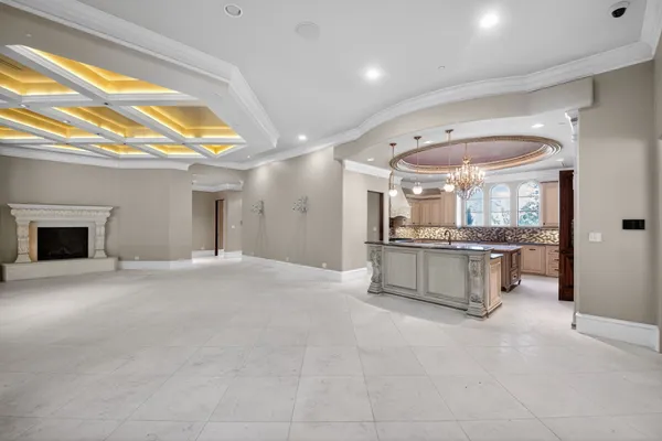 a view of a hallway with wooden floor and dining room