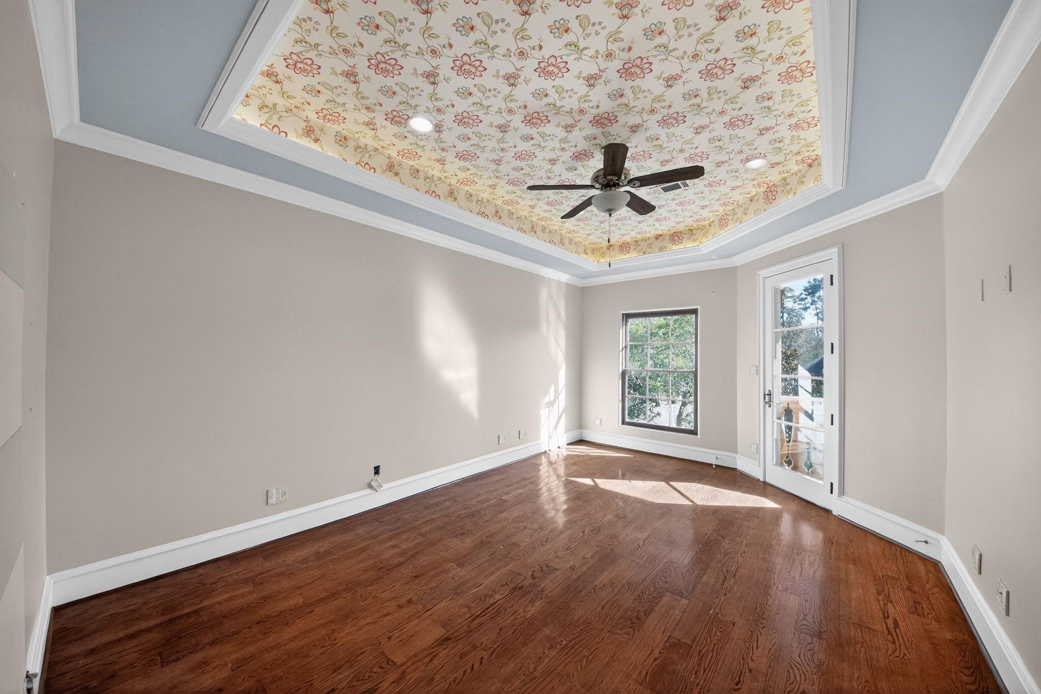 11117 Beinhorn Road Houston, TX 77024 - Photo 21 of 48 a view of a livingroom with wooden floor and a ceiling fan