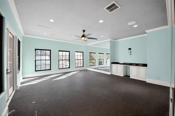 a spacious bathroom with a sink and a mirror