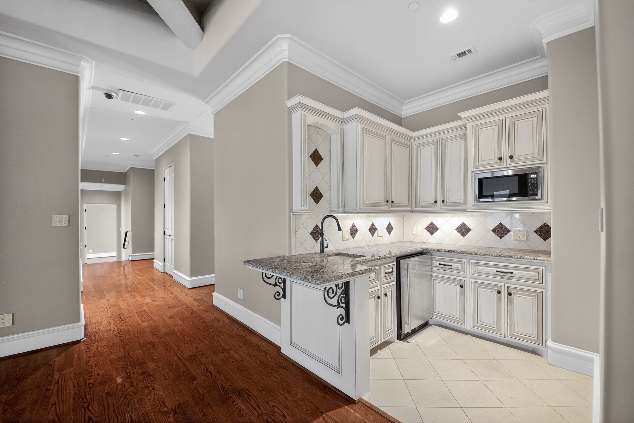 11117 Beinhorn Road Houston, TX 77024 - Photo 4 of 48 a kitchen with stainless steel appliances granite countertop a sink and cabinets