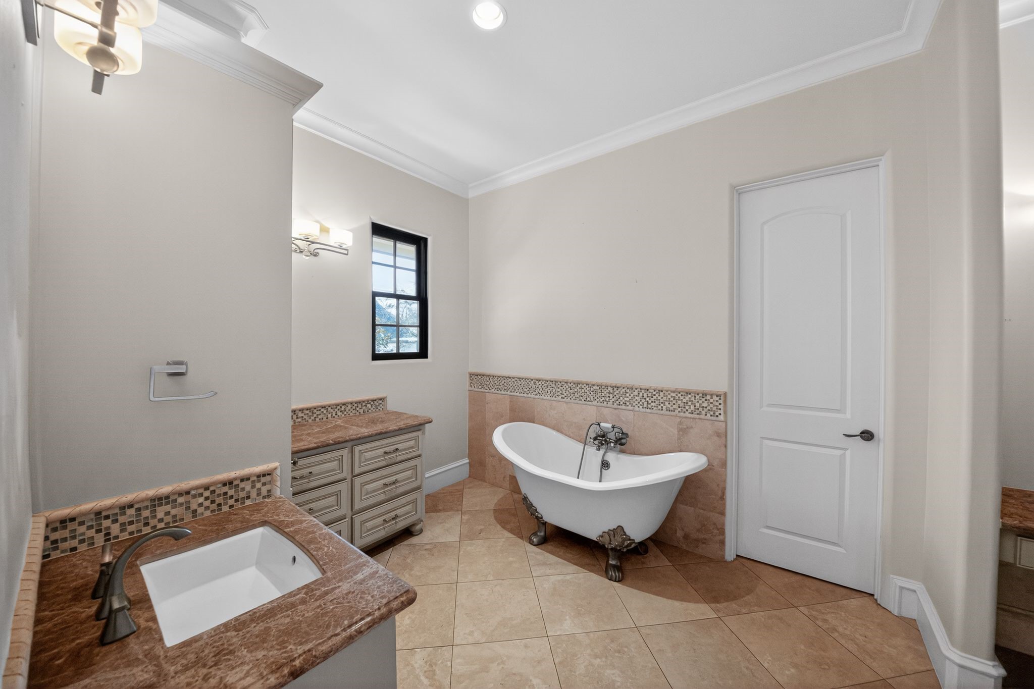 11117 Beinhorn Road Houston, TX 77024 - Photo 44 of 48 a spacious bathroom with a sink and a mirror