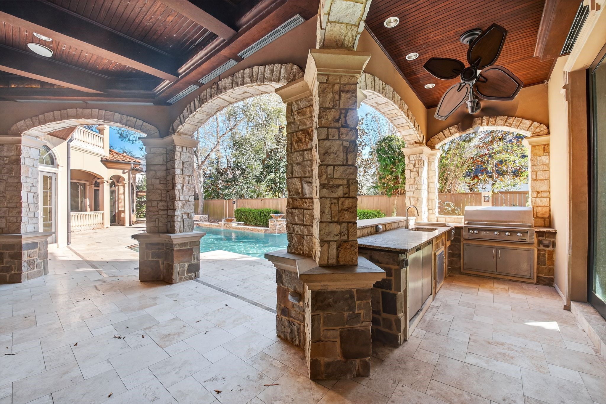 11117 Beinhorn Road Houston, TX 77024 - Photo 5 of 48 a outdoor space with patio furniture and flat screen tv