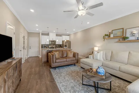 a kitchen with stainless steel appliances granite countertop a sink a stove and a refrigerator