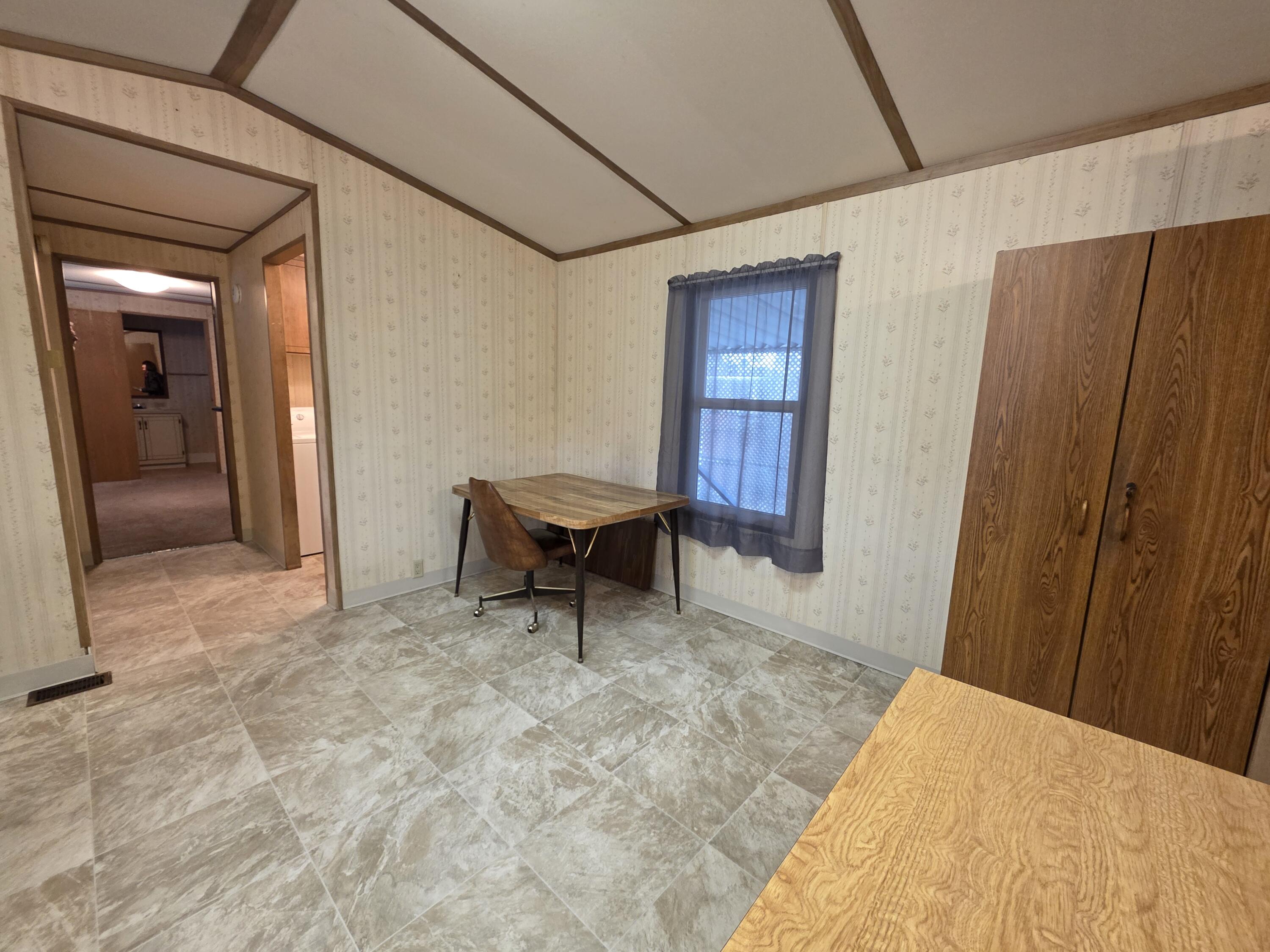 301 Freeman Road, Unit 30 Central Point, OR 97502 - Photo 4 of 26 a bedroom with a bed and furniture