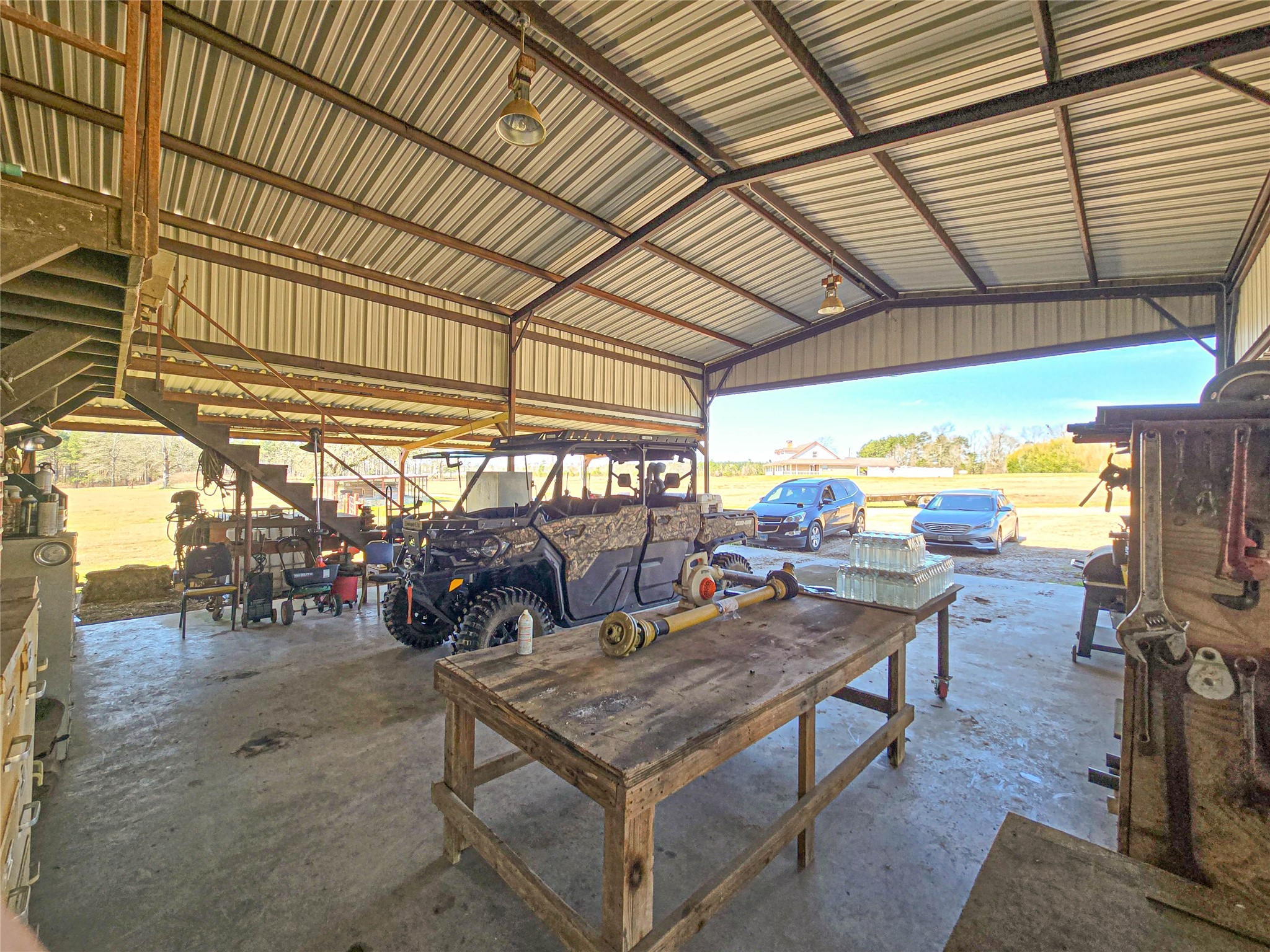 684 Hooks Road Corrigan, TX 75939 - Photo 14 of 34 a view of a patio with table and chairs and wooden floor