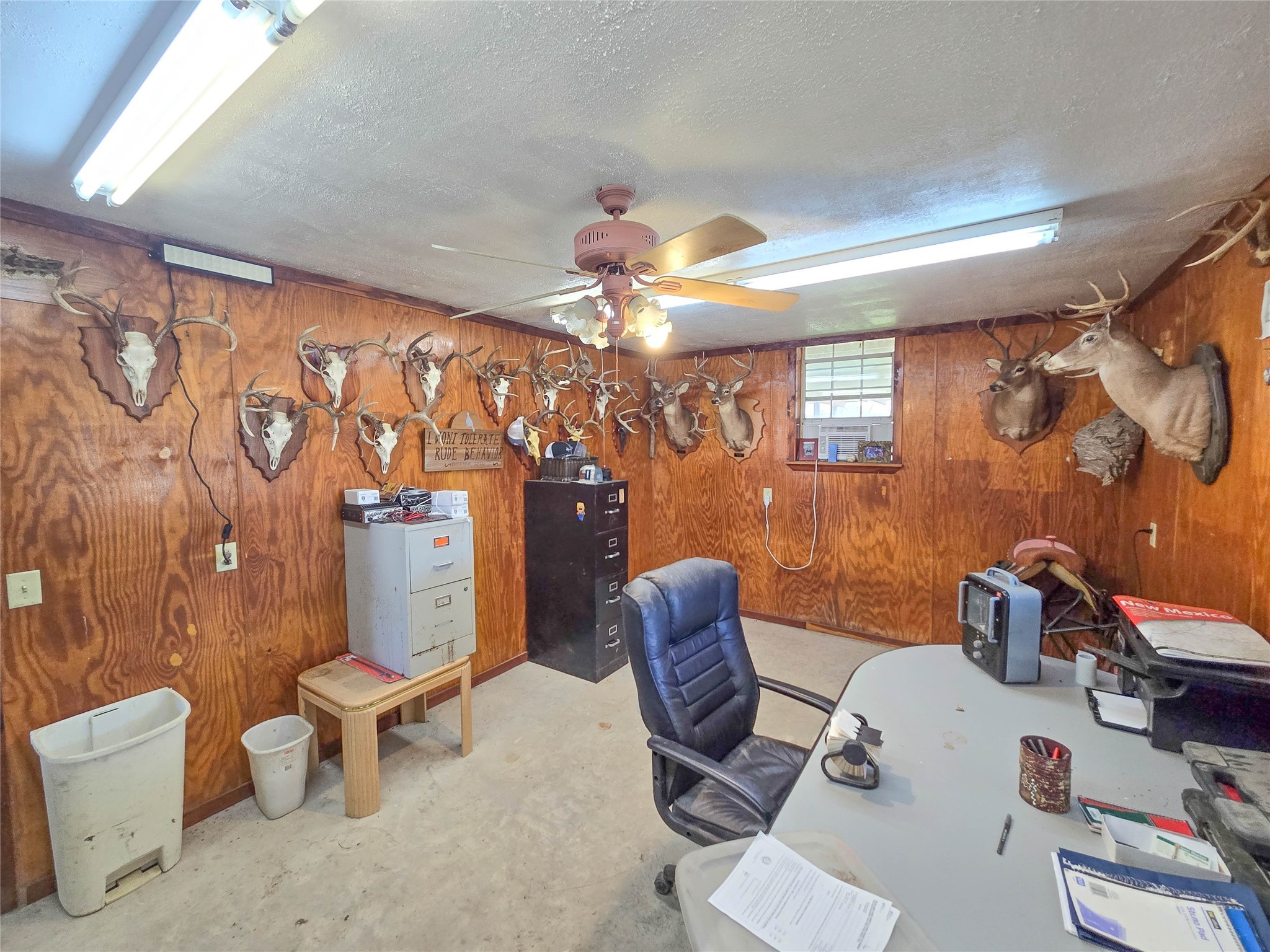 684 Hooks Road Corrigan, TX 75939 - Photo 20 of 34 a view of a workspace with furniture and a chandelier fan