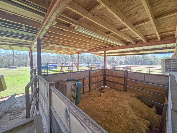 a view of a patio with table and chairs potted plants