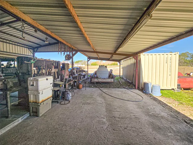 a bedroom with furniture and a chandelier