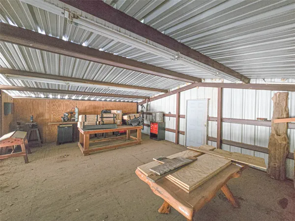 a backyard of a house with chairs