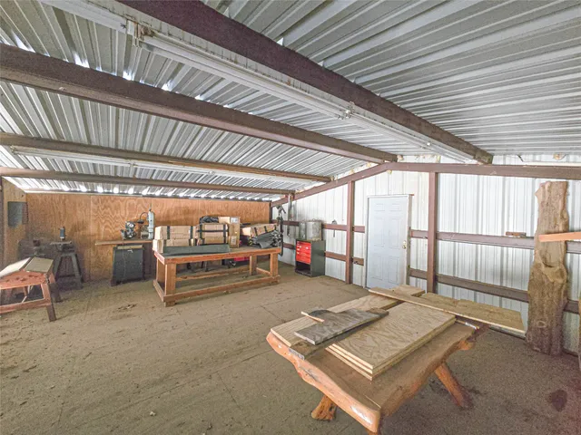 a backyard of a house with chairs