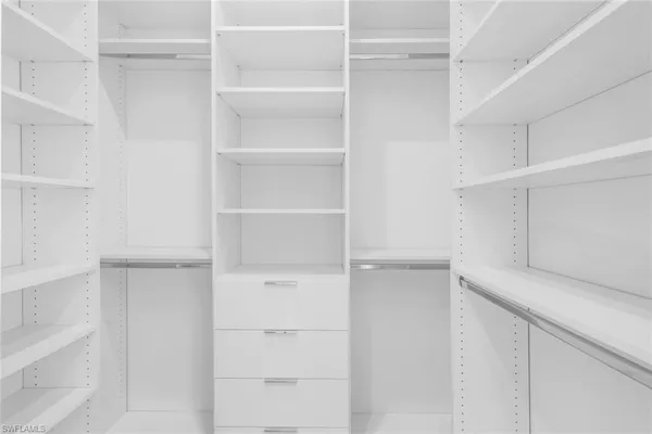 a view of an empty walk in closet