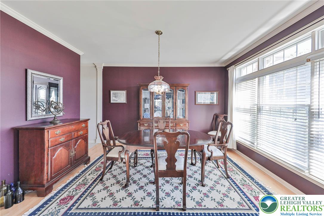 63 Long Road Lenhartsville, PA 19534 - Photo 34 of 100 Elegant crown molding complements the expansive windows in this formal dining space.