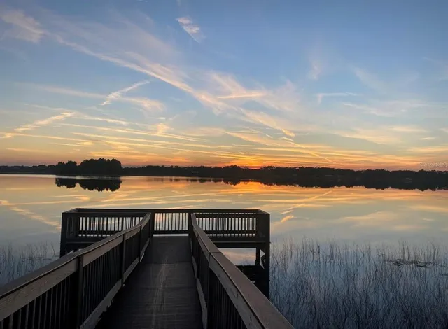 a view of a lake and outdoor seating