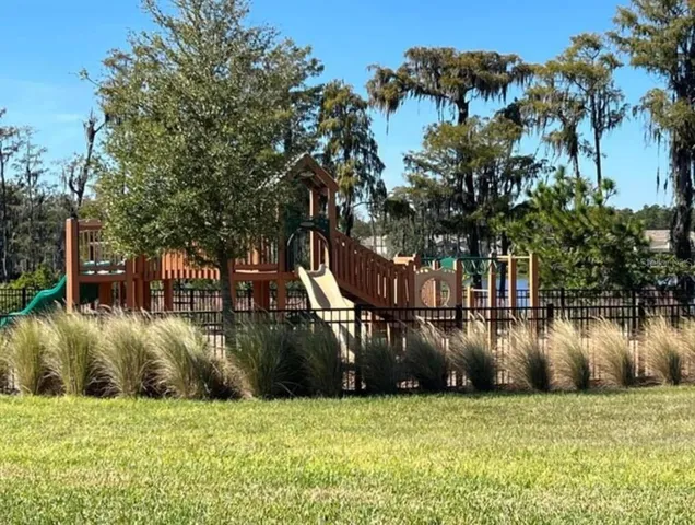 a view of a lake with a house in the background