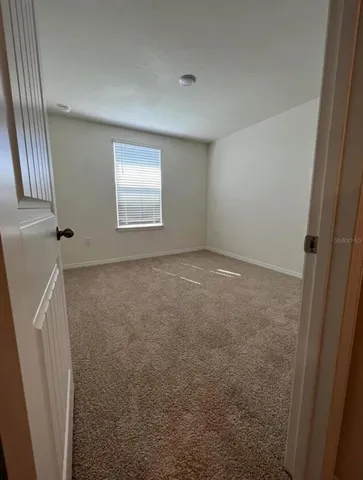 en empty room with windows