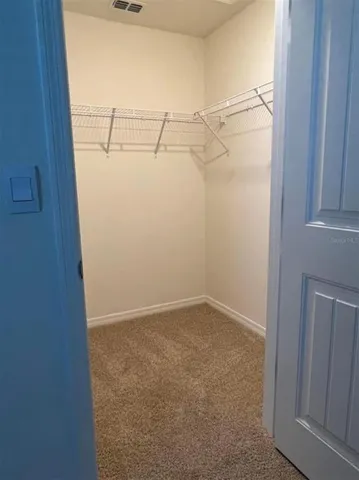 a view of a room with racks on the wall