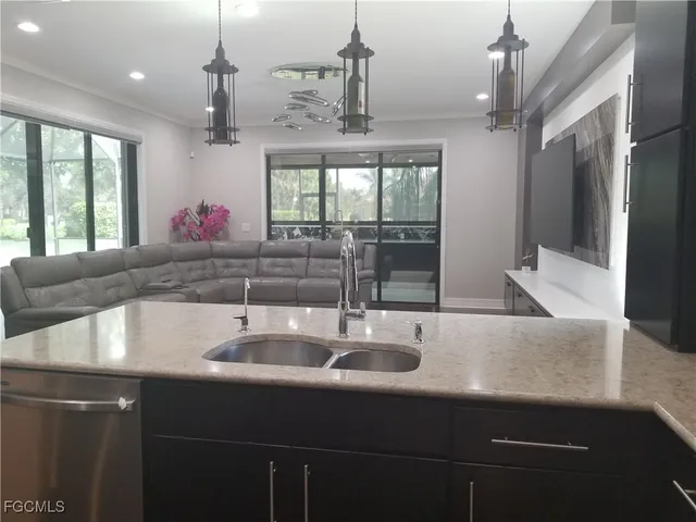 a kitchen with a sink and a window