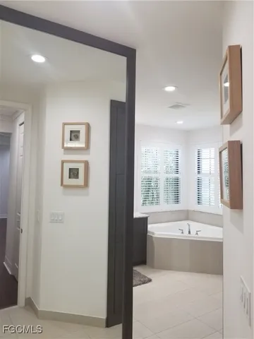 a bathroom with a bathtub and a sink
