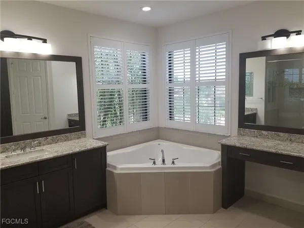 a bathroom with a bathtub and a sink