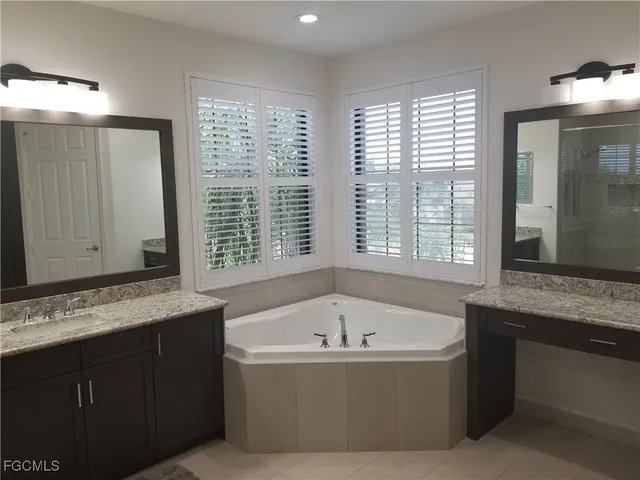 a bathroom with a bathtub and a sink