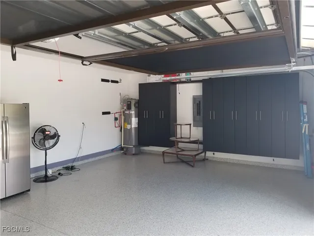a view of a room with wooden floor and a fireplace