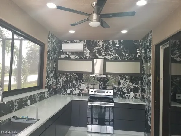 a view of a lake with houses in the back