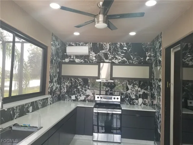 a view of a lake with houses in the back