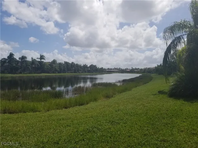 a view of a lake with a yard