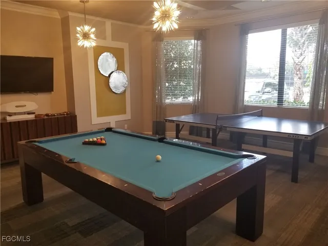 a view of a porch with furniture and garden