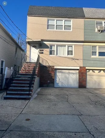a view of a house with a street