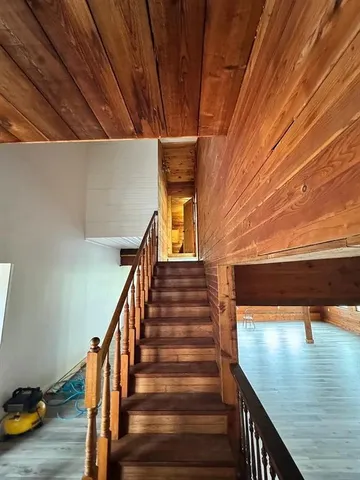 a bathroom with a shower and toilet