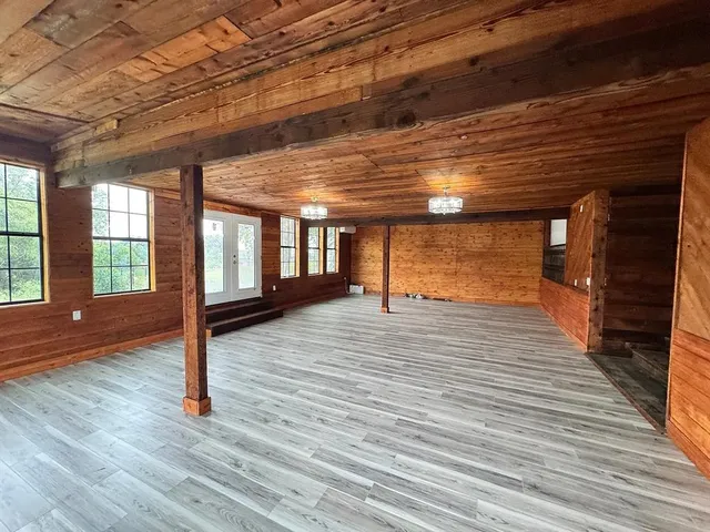 a view of entryway with wooden floor
