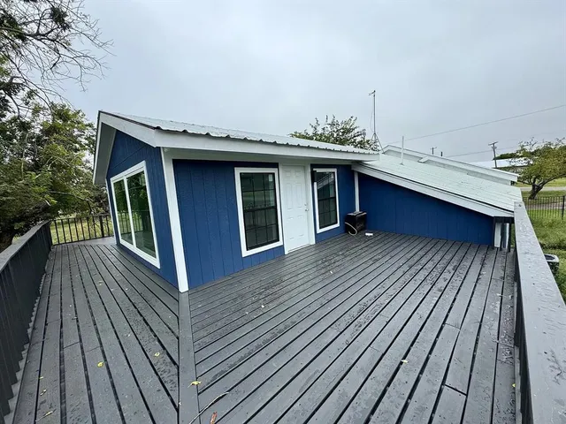 a balcony with trees in front of it