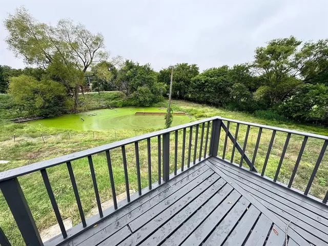 a balcony with wooden floor and floors