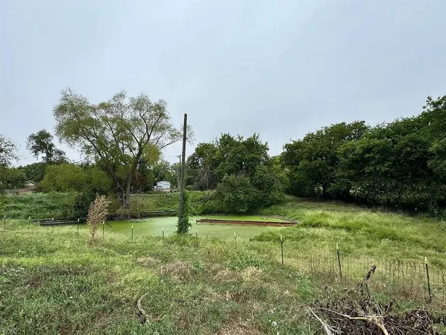 a view of balcony with wooden floor