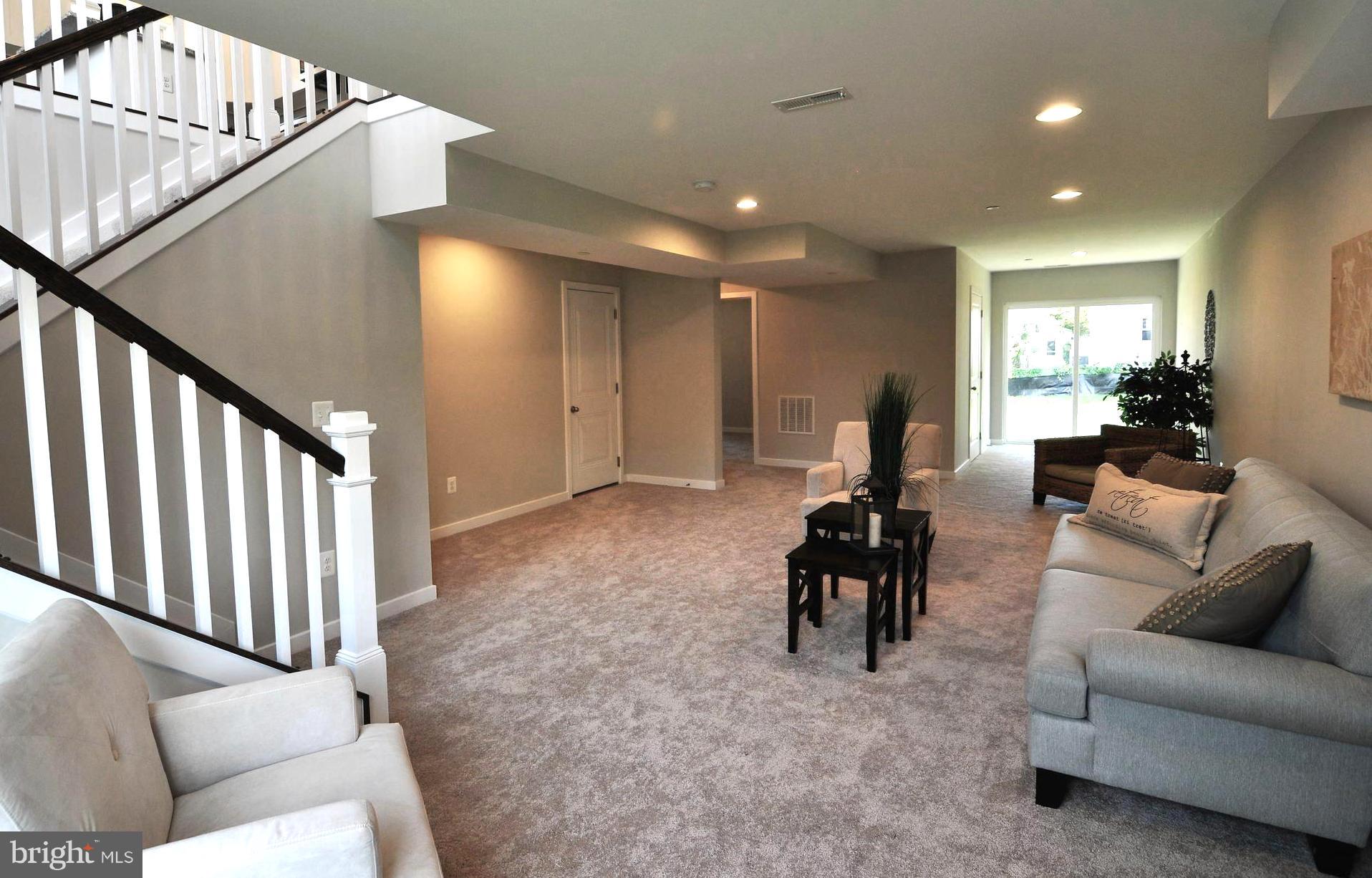 213 Meadow Road Pasadena, MD 21122 - Photo 21 of 30 Lower Level Family Room . Sliders to Rear Yard
