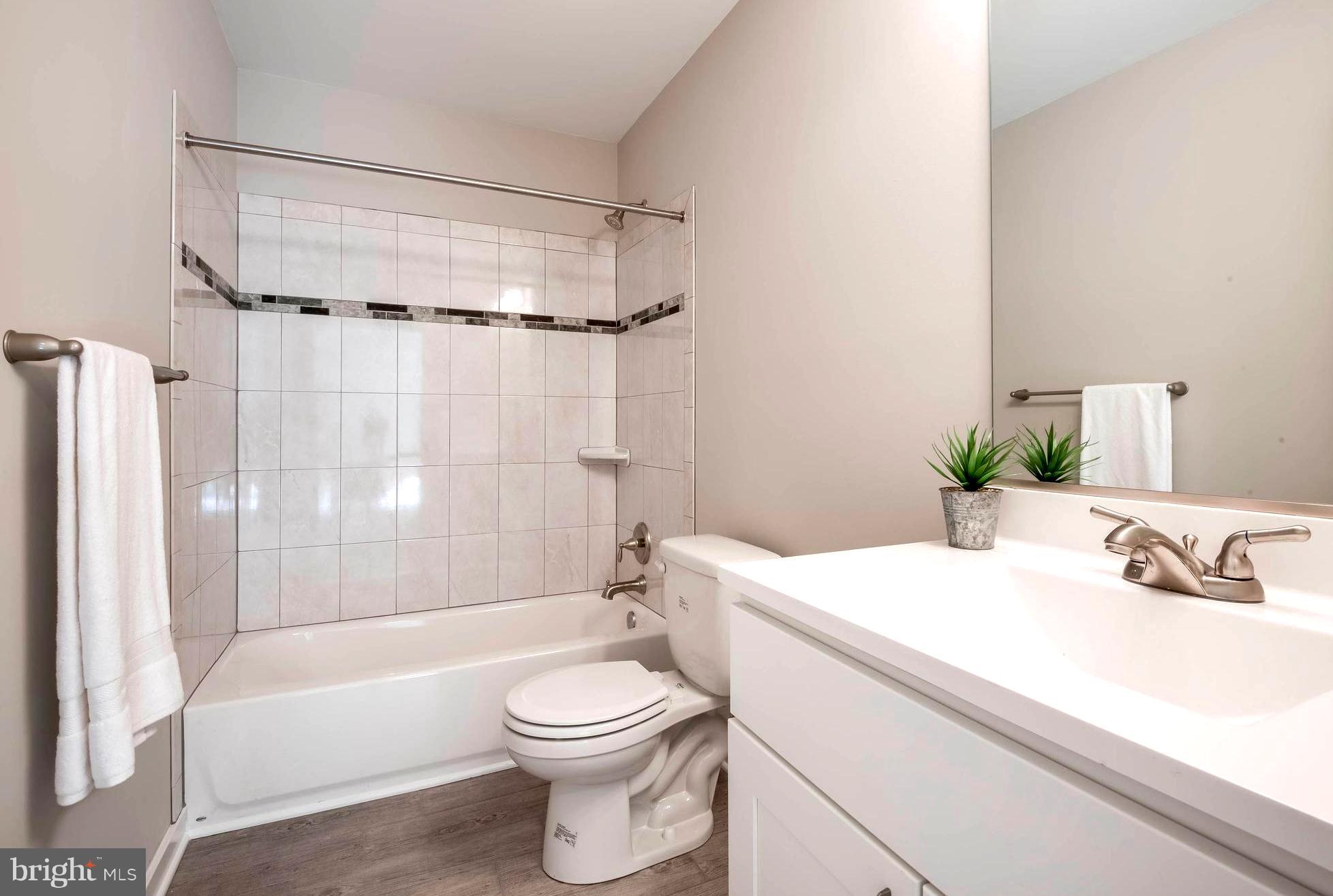 213 Meadow Road Pasadena, MD 21122 - Photo 26 of 30 Lower Level Inlaid Tile Full Bath