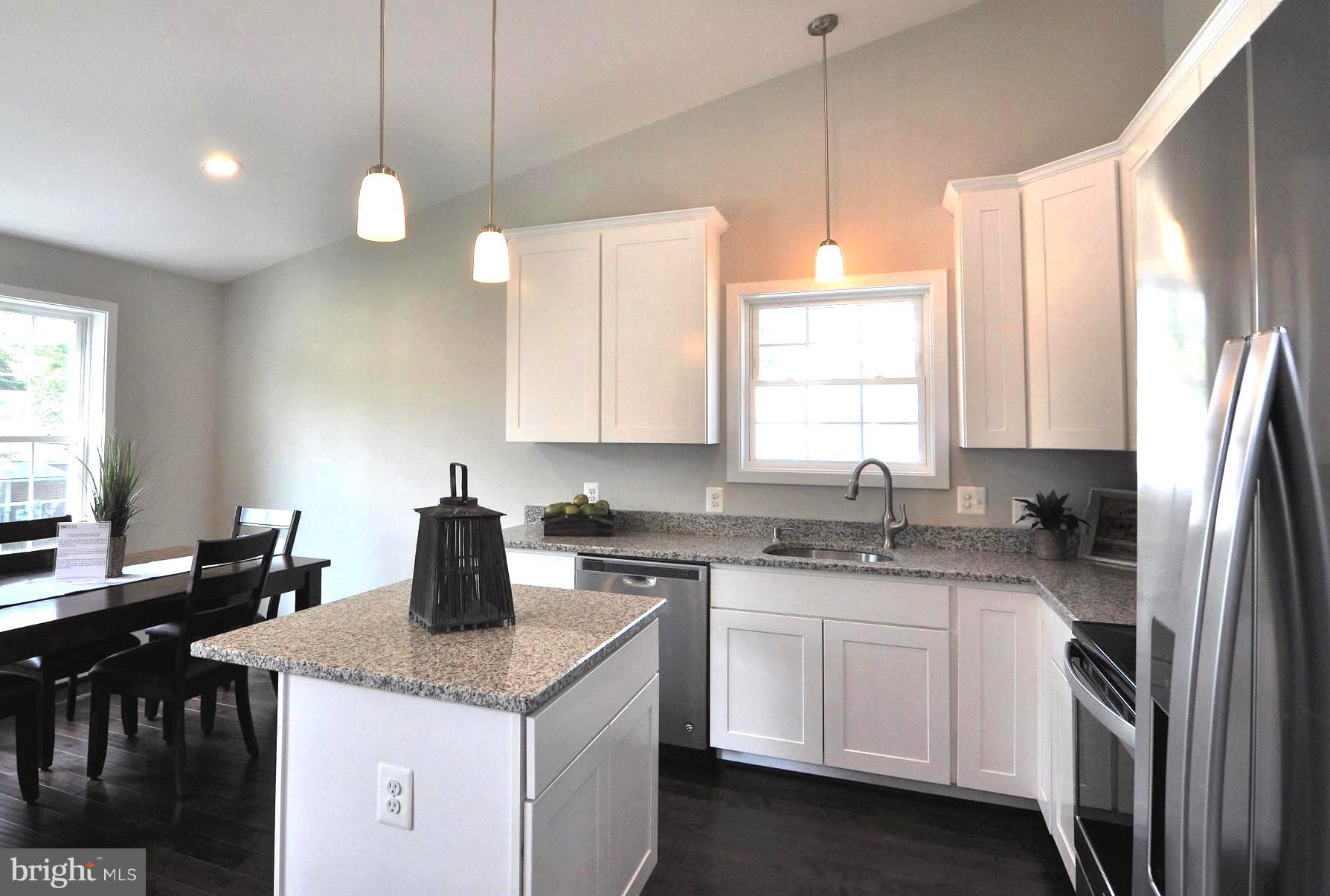213 Meadow Road Pasadena, MD 21122 - Photo 9 of 30 Free-Flow into Vaulted Chef's Kitchen