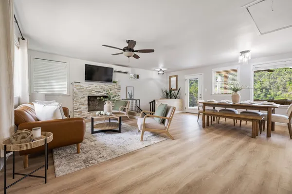 a living room with furniture fireplace and a flat screen tv