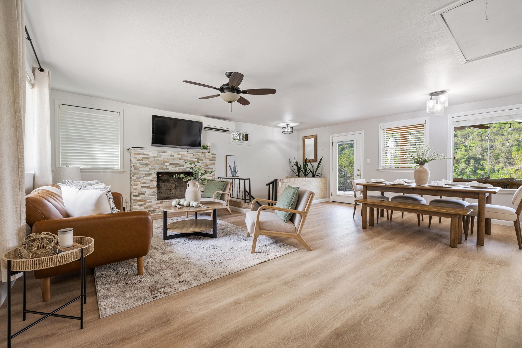 a living room with furniture fireplace and a flat screen tv