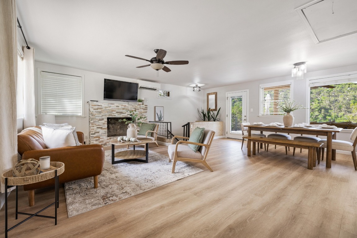 a living room with furniture fireplace and a flat screen tv