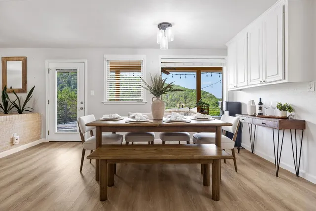 a view of a dining room with furniture window and wooden floor