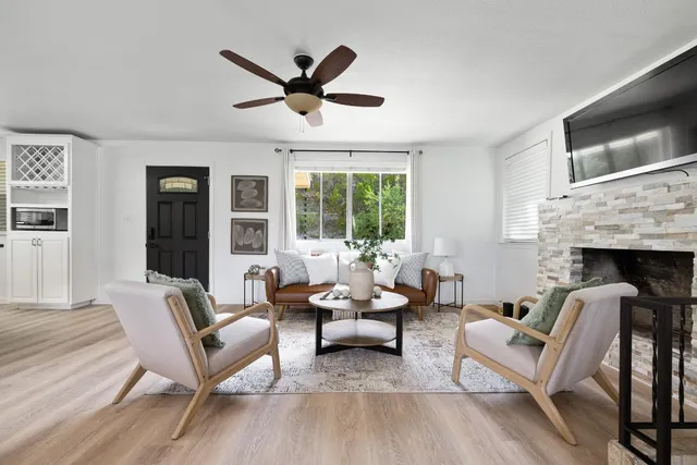 a living room with furniture and a fireplace