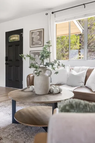 a living room with furniture and a large window