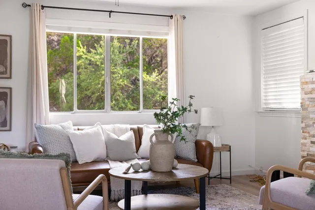 a dining room with furniture and window