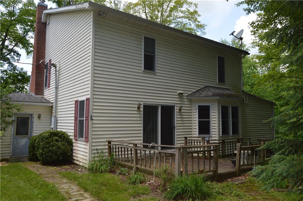 3244 Maple Lane Jamestown, PA 16134 - Photo 24 of 27 a view of a house with a yard and plants