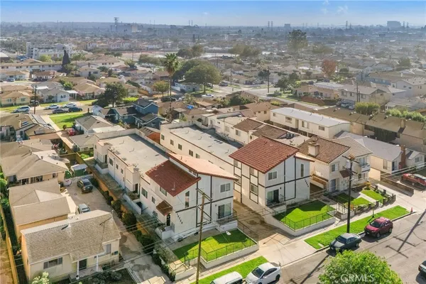 an aerial view of a house with a mountain