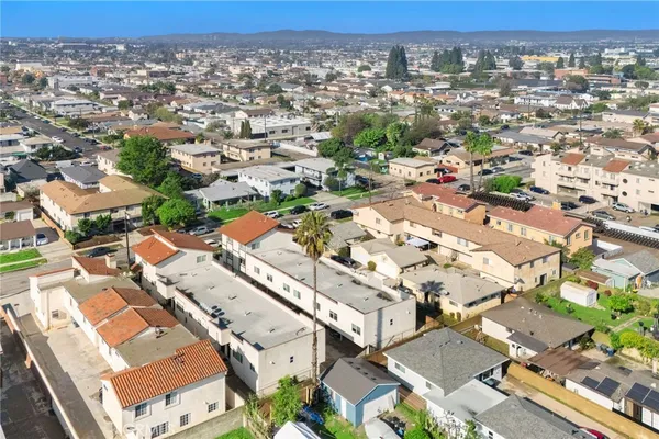 an aerial view of residential houses with outdoor space